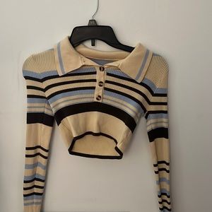 A trendy sweater size small. Stretchy material, and super trendy.
